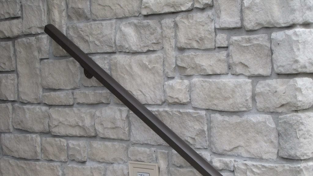 Aluminum-Handrail-Direct-handrail-installed-on-stone-wall